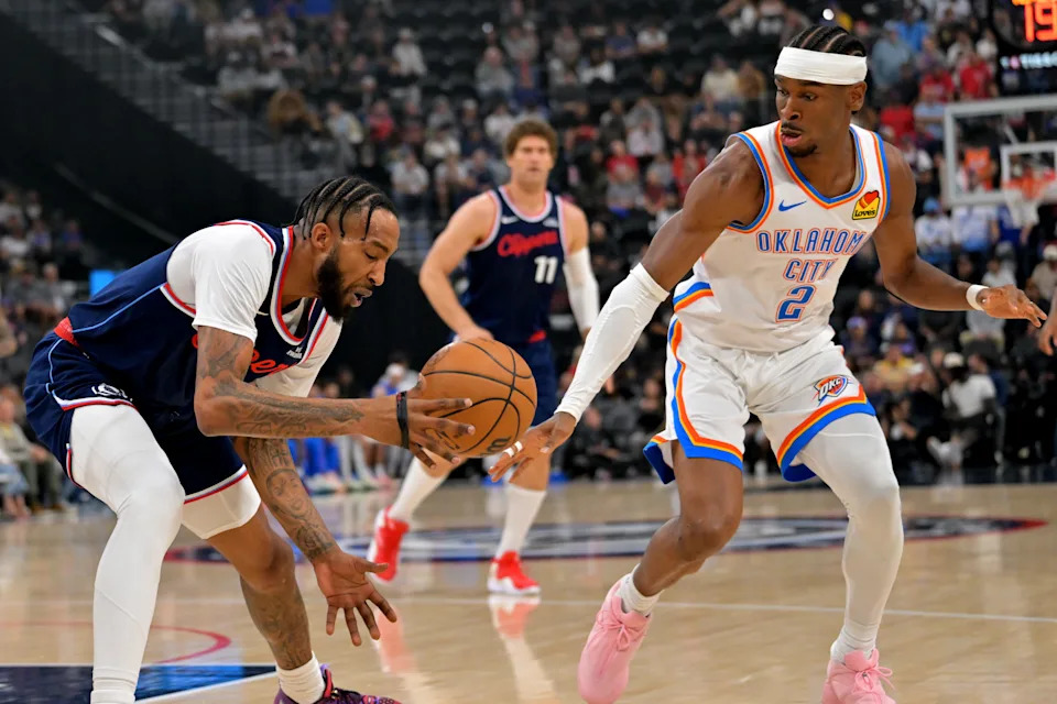Apr 8, 2026; Inglewood, California, USA; Oklahoma City Thunder guard Shai Gilgeous-Alexander (2) Los Angeles Clippers forward Derrick Jones Jr. (5) in the first half at Intuit Dome. Mandatory Credit: Jayne Kamin-Oncea-Imagn Images