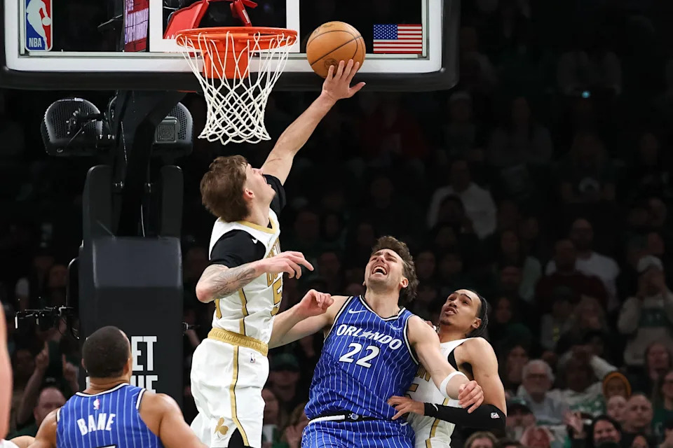 Apr 12, 2026; Boston, Massachusetts, USA; Boston Celtics guard Baylor Scheierman (55) blocks Orlando Magic forward Franz Wagner (22) during the second half at TD Garden. Mandatory Credit: Paul Rutherford-Imagn Images
