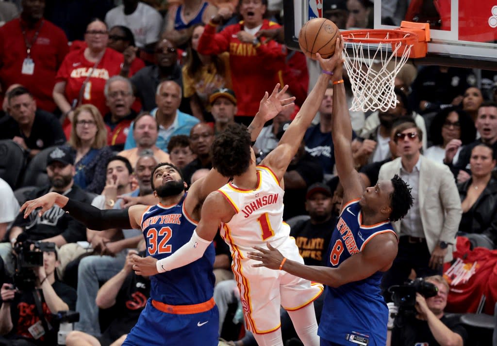 Atlanta Hawks forward Jalen Johnson (1) goes up for a shot between New York Knicks center Karl-Anthony Towns (32) and New York Knicks forward OG Anunoby. Charles Wenzelberg / New York Post