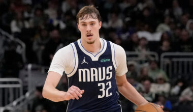 Cooper Flagg #32 of the Dallas Mavericks brings the ball up the court against the Milwaukee Bucks at Fiserv Forum.