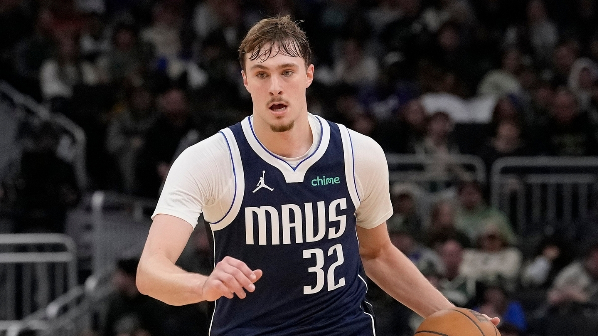 Cooper Flagg #32 of the Dallas Mavericks brings the ball up the court against the Milwaukee Bucks at Fiserv Forum.