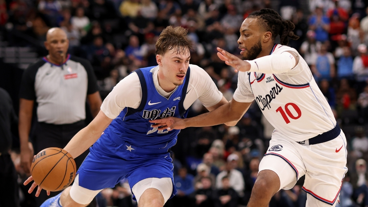 Cooper Flagg #32 of the Dallas Mavericks drives to the basket against Darius Garland #10 of the Los Angeles Clippers during the fourth quarter at Intuit Dome.