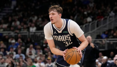 Cooper Flagg #32 of the Dallas Mavericks brings the ball up the court against the Milwaukee Bucks during the fourth quarter at Fiserv Forum on March 31, 2026.