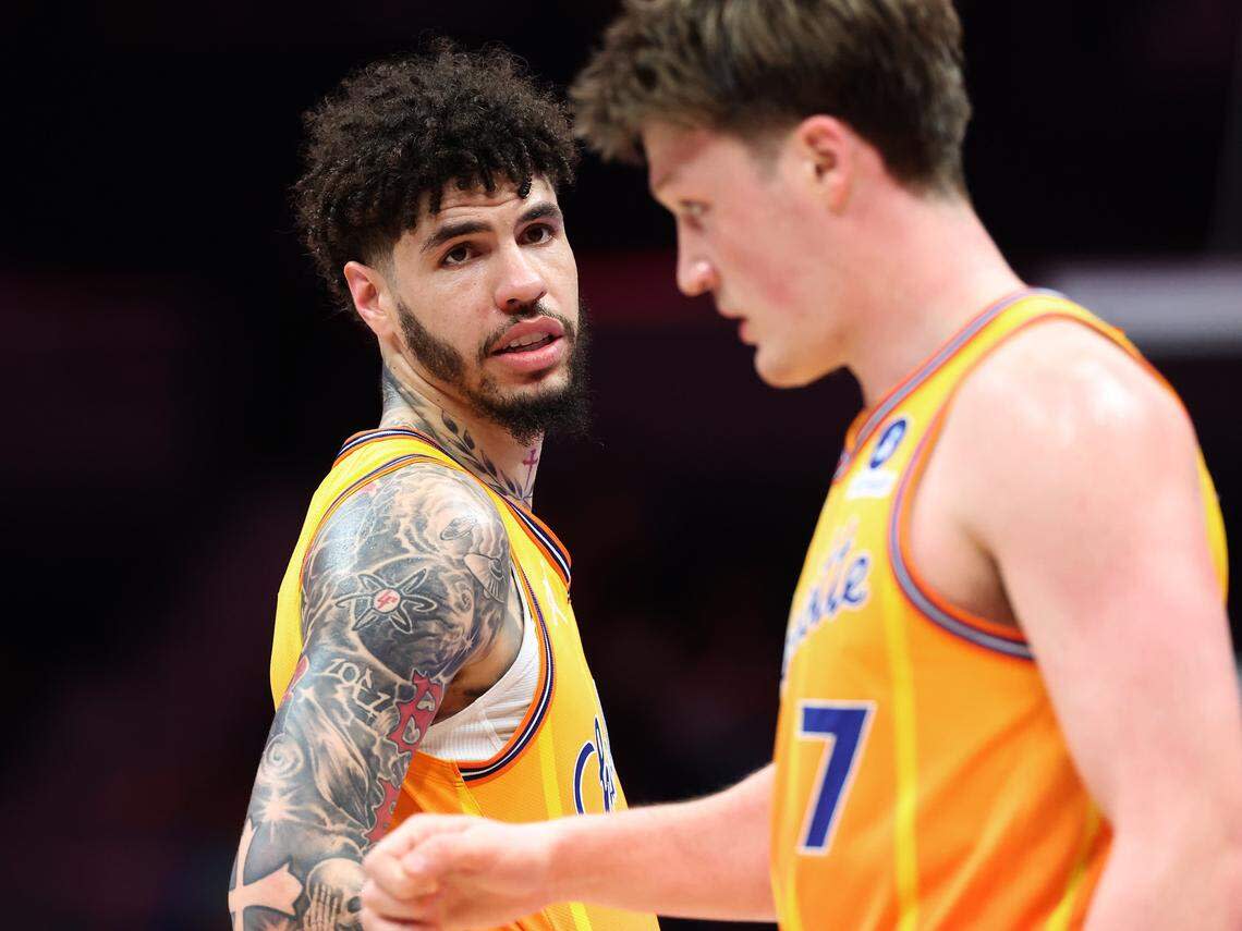 Charlotte Hornets guard LaMelo Ball, left, speaks to forward Kon Knueppel, right, during action against the Memphis Grizzlies at Spectrum Center in Charlotte, NC on Saturday, March 21, 2026. The Hornets defeated the Grizzlies 124-101.