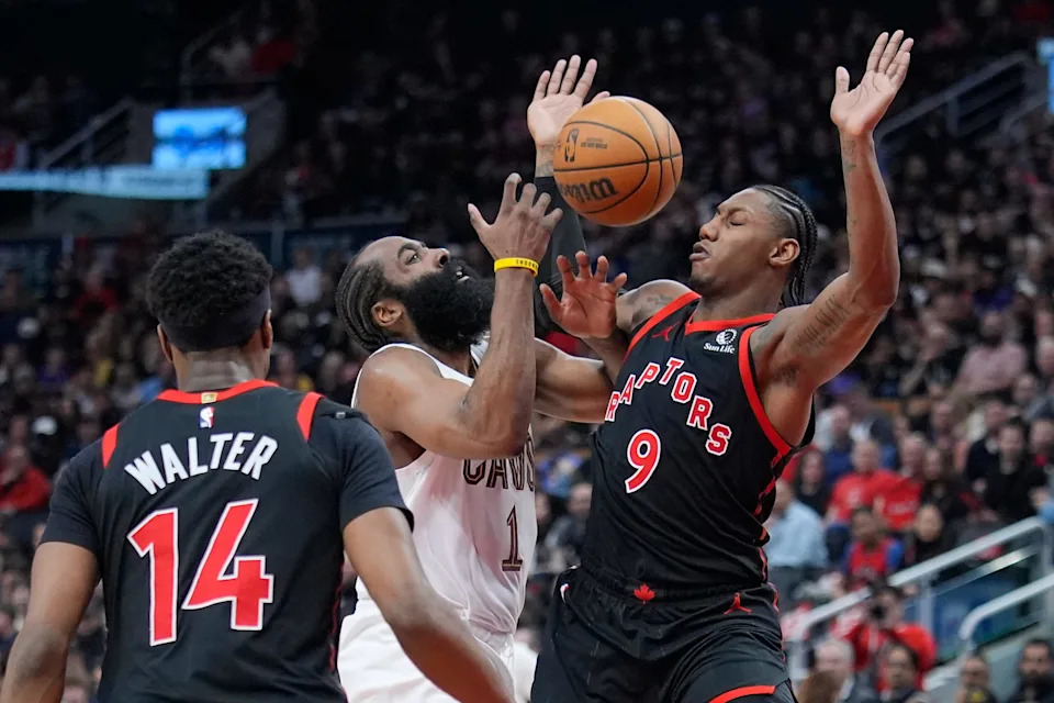 Cleveland Cavaliers guard James Harden (1) loses the ball while colliding with Toronto Raptors forward RJ Barrett (9) during Game 3 of an NBA playoffs first-round series April 23, 2026, in Toronto, Ontario.