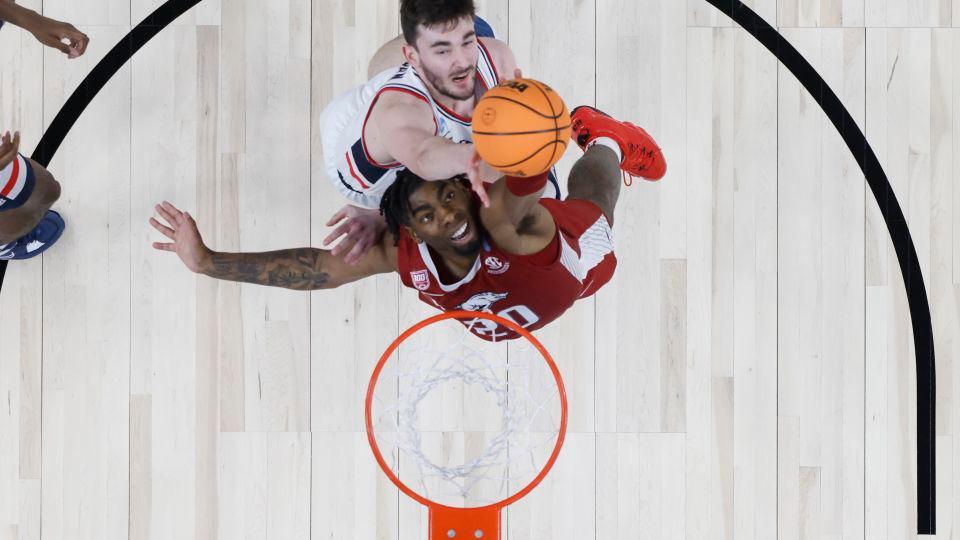 Arkansas Razorbacks forward Kamani Johnson battles Karaban for a rebound during the second half in the 2023 Sweet 16. - Sean M. Haffey/Getty Images