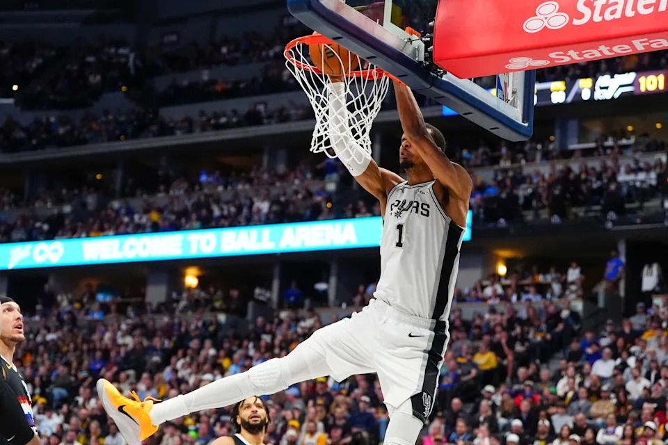 Apr 4, 2026; Denver, Colorado, USA; San Antonio Spurs forward Victor Wembanyama (1) dunks the basketball in the second half against the Denver Nuggets at Ball Arena. Mandatory Credit: Ron Chenoy-Imagn Images