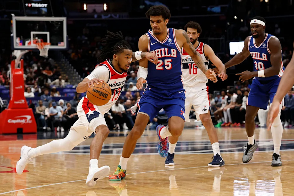 Apr 1, 2026; Washington, District of Columbia, USA; Washington Wizards guard Sharife Cooper (13) drives to the basket as Philadelphia 76ers forward Dominick Barlow (25) defends in the second half at Capital One Arena. Mandatory Credit: Geoff Burke-Imagn Images