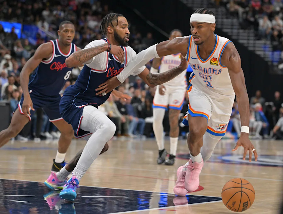 Apr 8, 2026; Inglewood, California, USA; Oklahoma City Thunder guard Shai Gilgeous-Alexander (2) is defended by Los Angeles Clippers forward Derrick Jones Jr. (5) in the second half at Intuit Dome. Mandatory Credit: Jayne Kamin-Oncea-Imagn Images