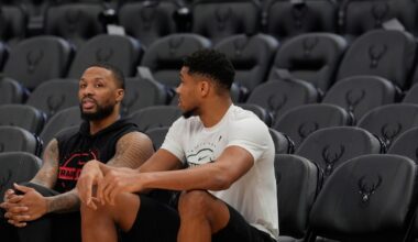 Damian Lillard #0 of the Portland Trail Blazers and Giannis Antetokounmpo #34 of the Milwaukee Bucks talk at Fiserv Forum on November 24, 2025.