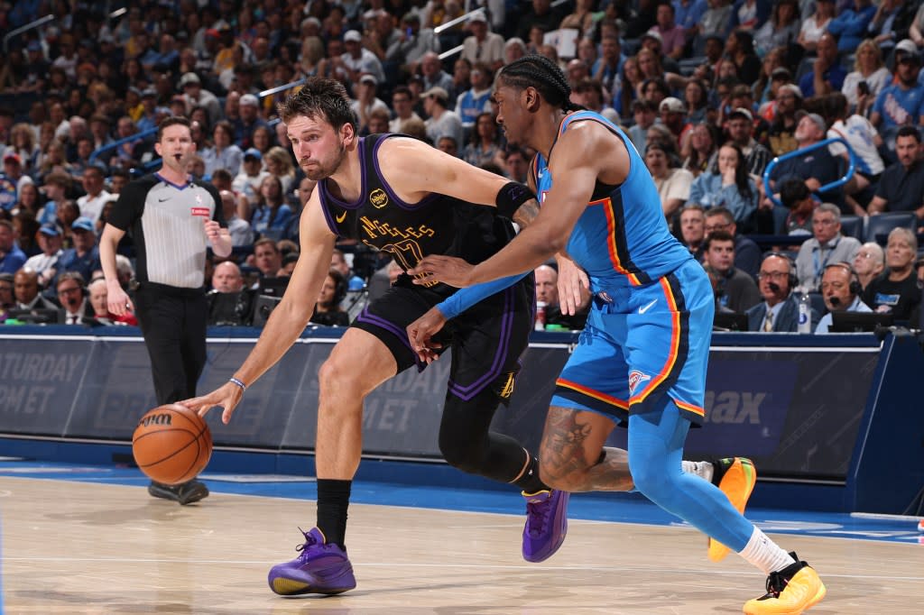 Luka Doncic drives the ball against the Thunder. NBAE via Getty Images