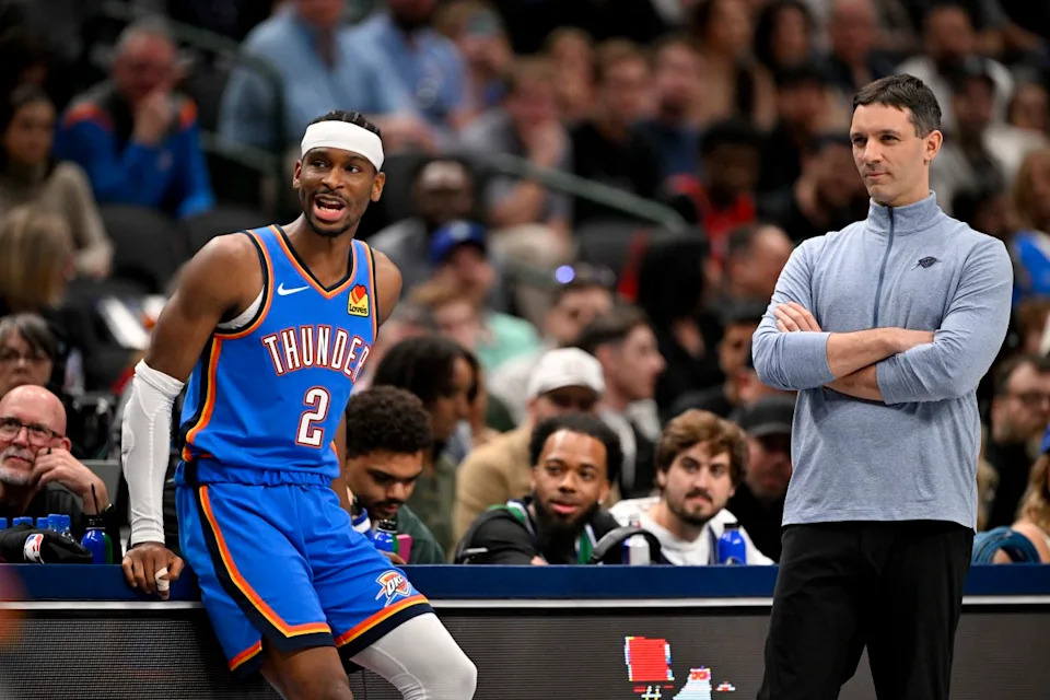 Oklahoma City Thunder guard Shai Gilgeous-Alexander (2) and head coach Mark Daigneault look on during the second quarter against the Dallas Mavericks at the American Airlines Center.Jerome Miron-Imagn Images