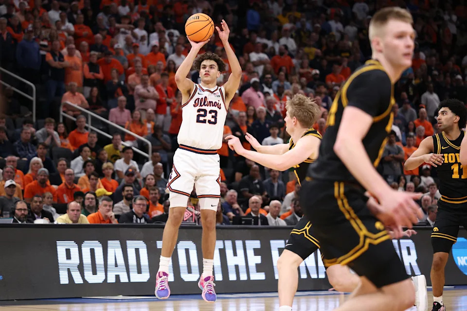 Mar 28, 2026; Houston, TX, USA; Illinois Fighting Illini guard Keaton Wagler (23) shoots against the Iowa Hawkeyes in the first half during an Elite Eight game of the South Regional of the men's 2026 NCAA Tournament at Toyota Center. Mandatory Credit: Troy Taormina-Imagn Images