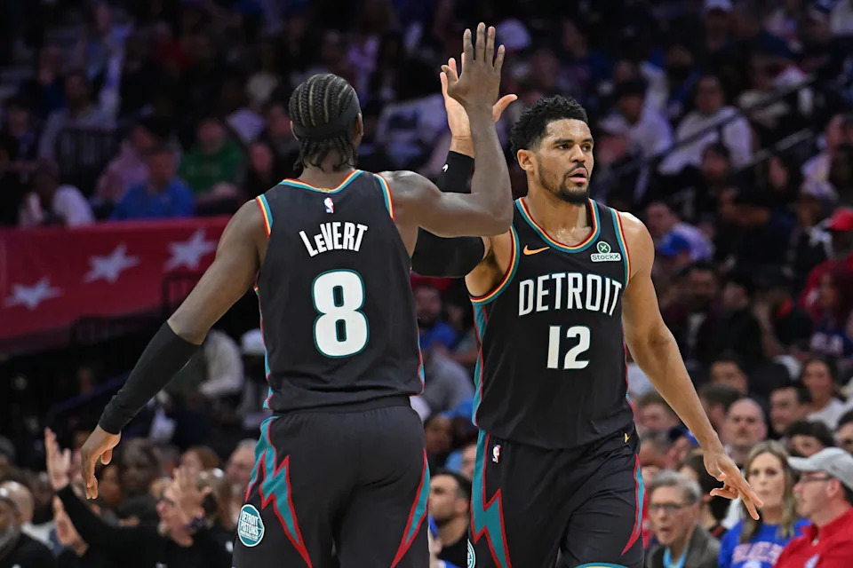 Apr 4, 2026; Philadelphia, Pennsylvania, USA; Detroit Pistons forward Tobias Harris (12) celebrates a basket with guard Caris LeVert (8) against the Philadelphia 76ers during the second half at Xfinity Mobile Arena. Mandatory Credit: Eric Hartline-Imagn Images