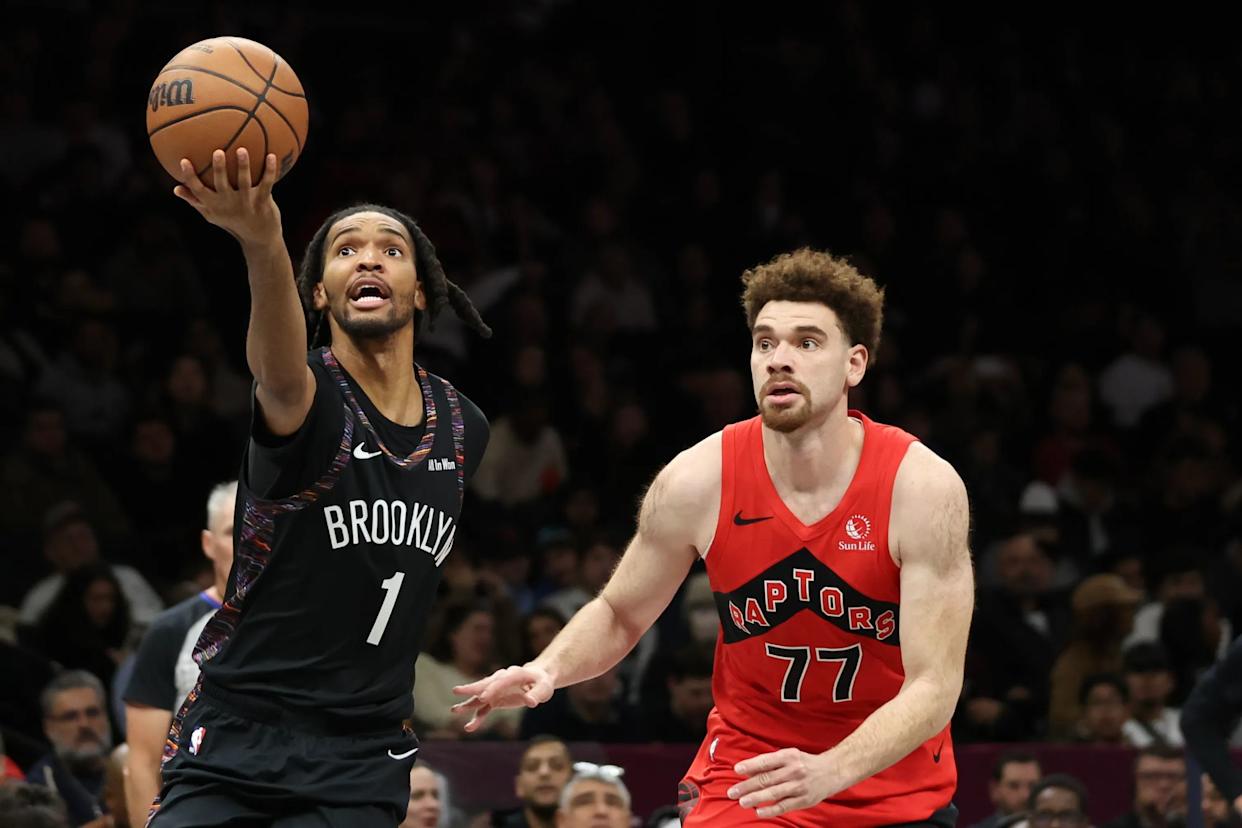 An image collage containing 1 images, Image 1 shows Brooklyn Nets forward Ziaire Williams (1) drives to the basket past Toronto Raptors’ Jamison Battle (77)