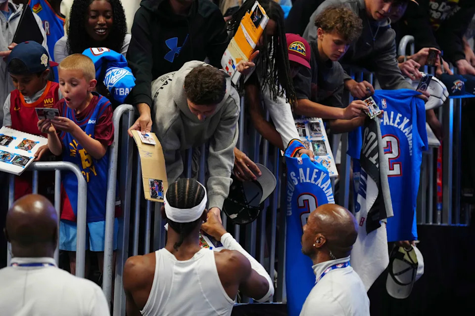 Apr 10, 2026; Denver, Colorado, USA; Oklahoma City Thunder guard Shai Gilgeous-Alexander (2) signs autographs before the game against the Denver Nuggets at Ball Arena. Mandatory Credit: Ron Chenoy-Imagn Images