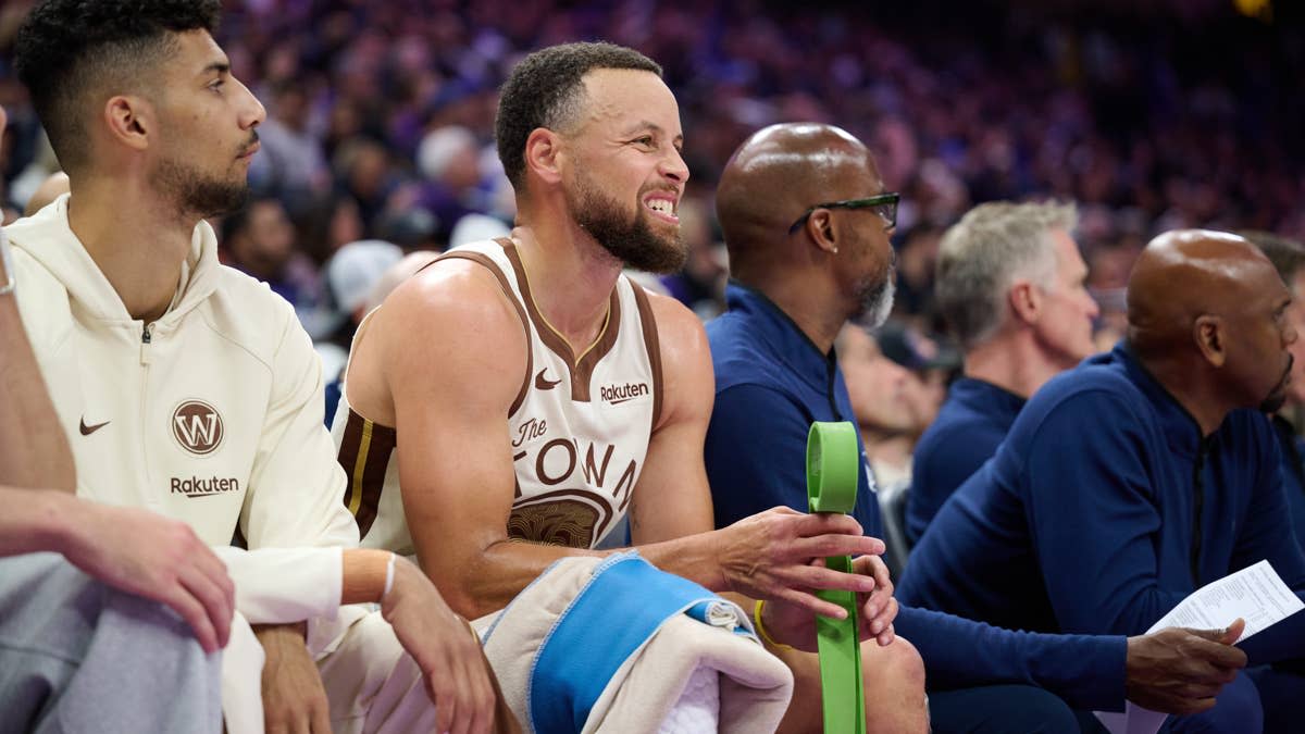 Golden State Warriors guard Stephen Curry (30) reacts on the bench against the Sacramento Kings during the second quarter at Golden 1 Center. Robert Edwards-Imagn Images
