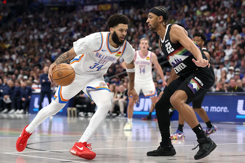 DENVER, COLORADO - APRIL 10: Kenrich Williams #34 of the Oklahoma City Thunder drives against Zeke Nnaji #22 of the Denver Nuggets during the thirdquarter at Ball Arena on April 10, 2026 in Denver, Colorado. NOTE TO USER: User expressly acknowledges and agrees that, by downloading and or using this photograph, User is consenting to the terms and conditions of the Getty Images License Agreement. (Photo by Matthew Stockman/Getty Images)