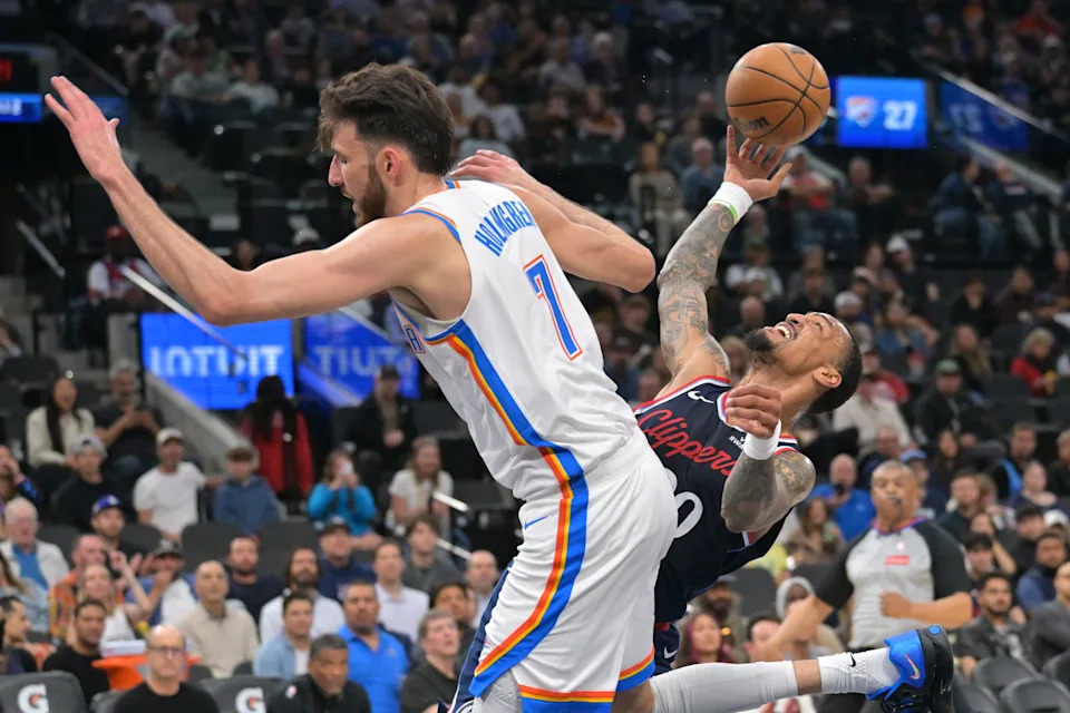Apr 8, 2026; Inglewood, California, USA; Los Angeles Clippers forward John Collins (20) is defended by Oklahoma City Thunder center Chet Holmgren (7) as he drives to the basket in the first half at Intuit Dome. Mandatory Credit: Jayne Kamin-Oncea-Imagn Images