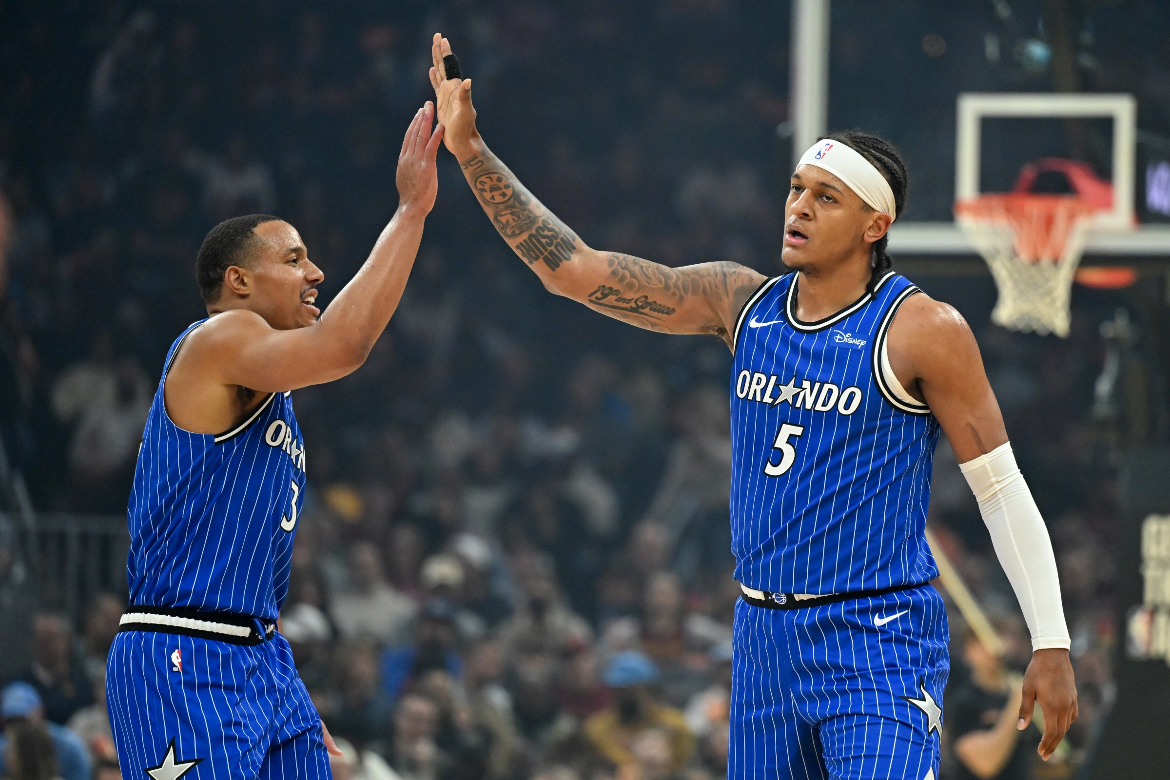 CLEVELAND, OHIO - MARCH 24: Desmond Bane #3 and Paolo Banchero #5 of the Orlando Magic celebrate a three-point basket made by Banchero during the first half against the Cleveland Cavaliers at Rocket Arena on March 24, 2026 in Cleveland, Ohio. NOTE TO USER: User expressly acknowledges and agrees that, by downloading and or using this photograph, User is consenting to the terms and conditions of the Getty Images License Agreement. (Photo by Nick Cammett/Getty Images)