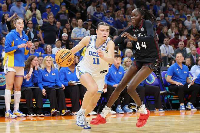 South Carolina v UCLA PHOENIX, ARIZONA - APRIL 05: Gabriela Jaquez #11 of the UCLA Bruins dribbles against Agot Makeer #44 of the South Carolina Gamecocks during the third quarter in the National Championship of the NCAA Women's Basketball Tournament at Mortgage Matchup Center on April 05, 2026 in Phoenix, Arizona. (Photo by Christian Petersen/Getty Images)