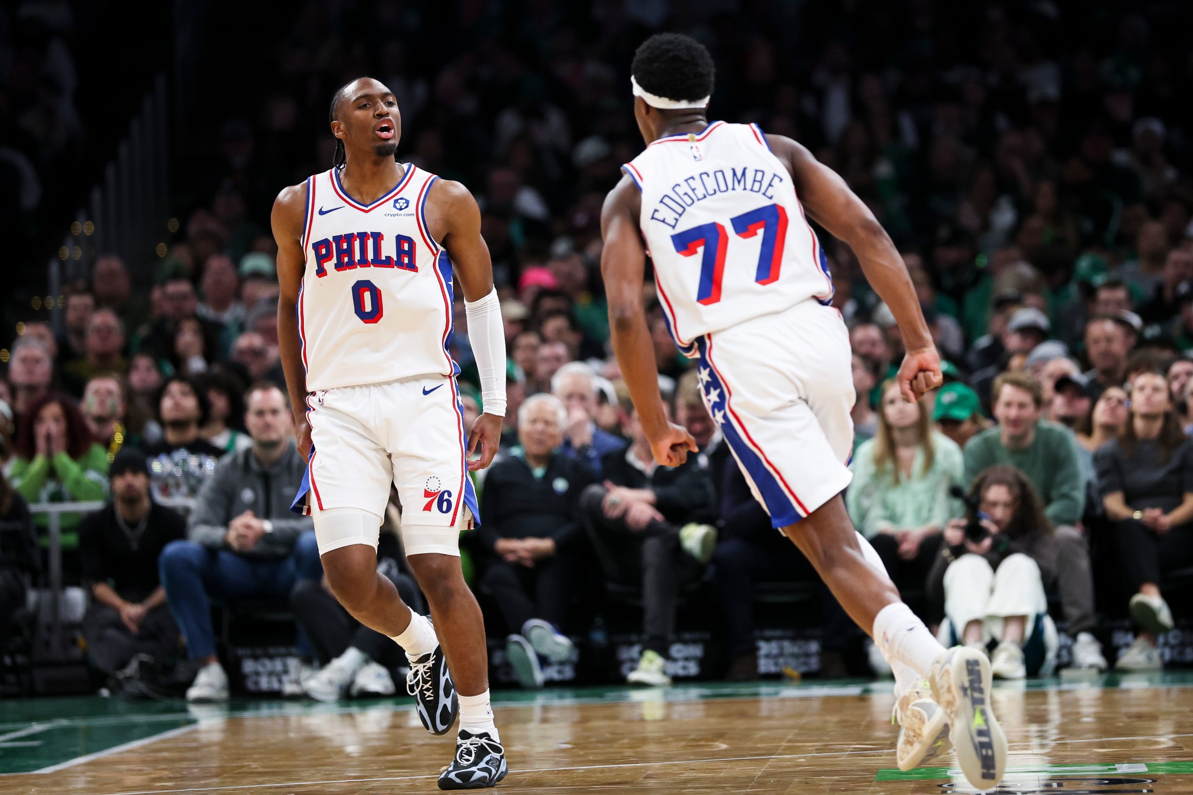 BOSTON, MA - APRIL 21: Vj Edgecombe #77 of the Philadelphia 76ers and Tyrese Maxey #0 of the Philadelphia 76ers react in the second quarter of a game against the Boston Celtics at TD Garden on April 21, 2026 in Boston, Massachusetts. NOTE TO USER: User expressly acknowledges and agrees that, by downloading and or using this photograph, User is consenting to the terms and conditions of the Getty Images License Agreement. (Photo by Adam Glanzman/Getty Images)