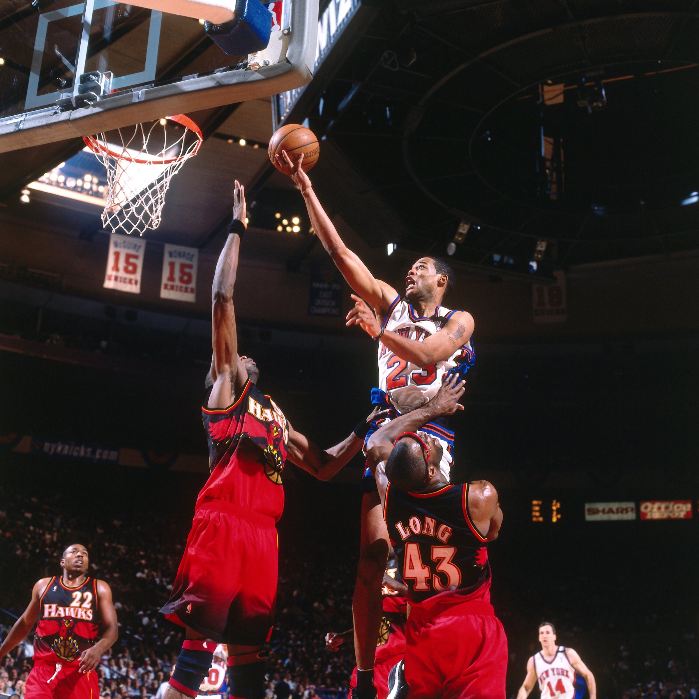 NEW YORK - MAY 23: Marcus Camby #23 of the New York Knicks shoots a layup against Dikembe Mutombo #55 of the Atlanta Hawks in Game Three of the Eastern Conference Semifinals during the 1999 NBA Playoffs at Madison Square Garden on May 23, 1999 in New York, New York. The Knicks won 90-78. NOTE TO USER: User expressly acknowledges that, by downloading and or using this photograph, User is consenting to the terms and conditions of the Getty Images License agreement. Mandatory Copyright Notice: Copyright 1999 NBAE (Photo by Nathaniel S. Butler/NBAE via Getty Images)