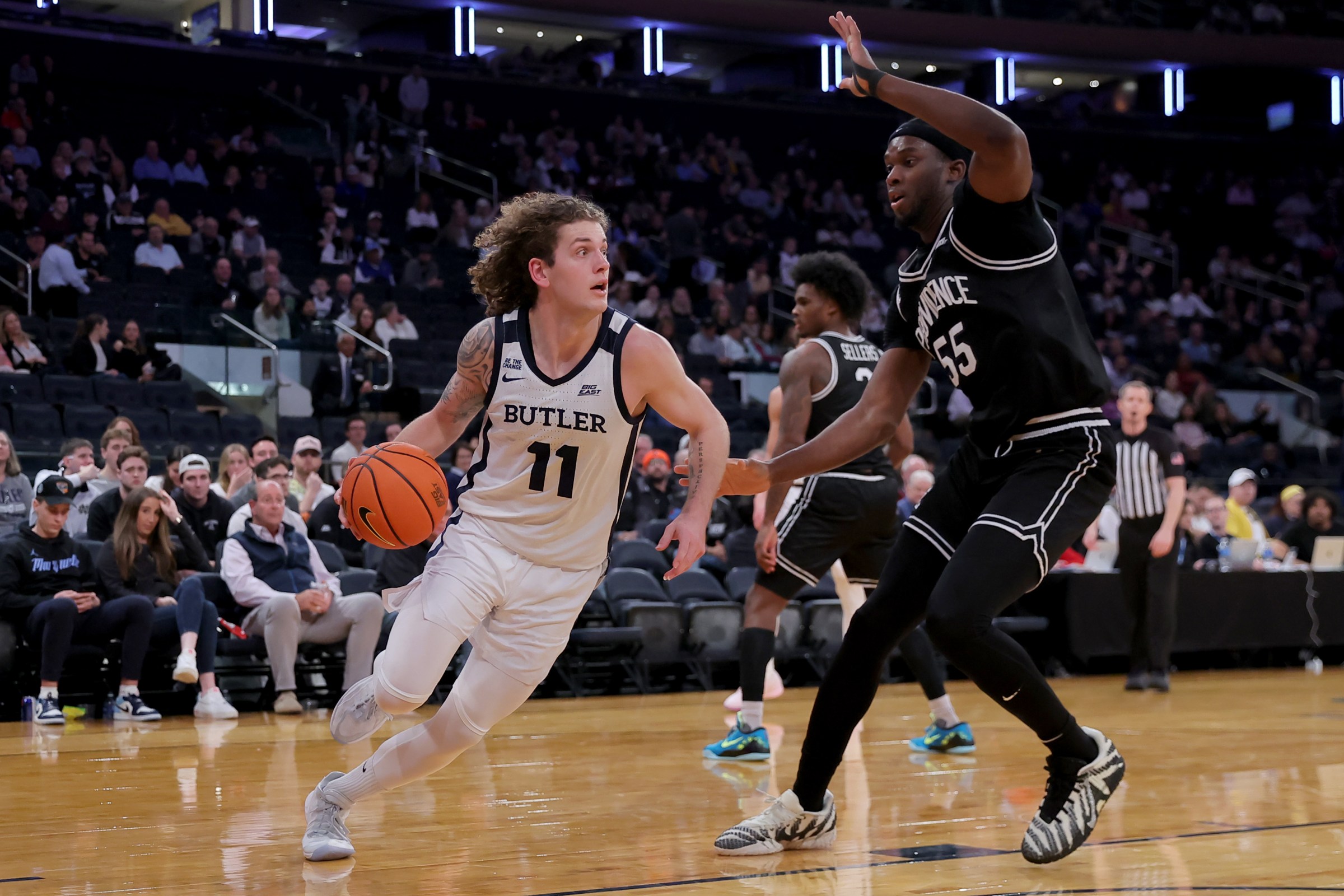 Mar 11, 2026; New York, NY, USA; Butler Bulldogs guard Finley Bizjack (11) controls the ball against Providence Friars forward Oswin Erhunmwunse (55) during the second half at Madison Square Garden. Mandatory Credit: Brad Penner-Imagn Images