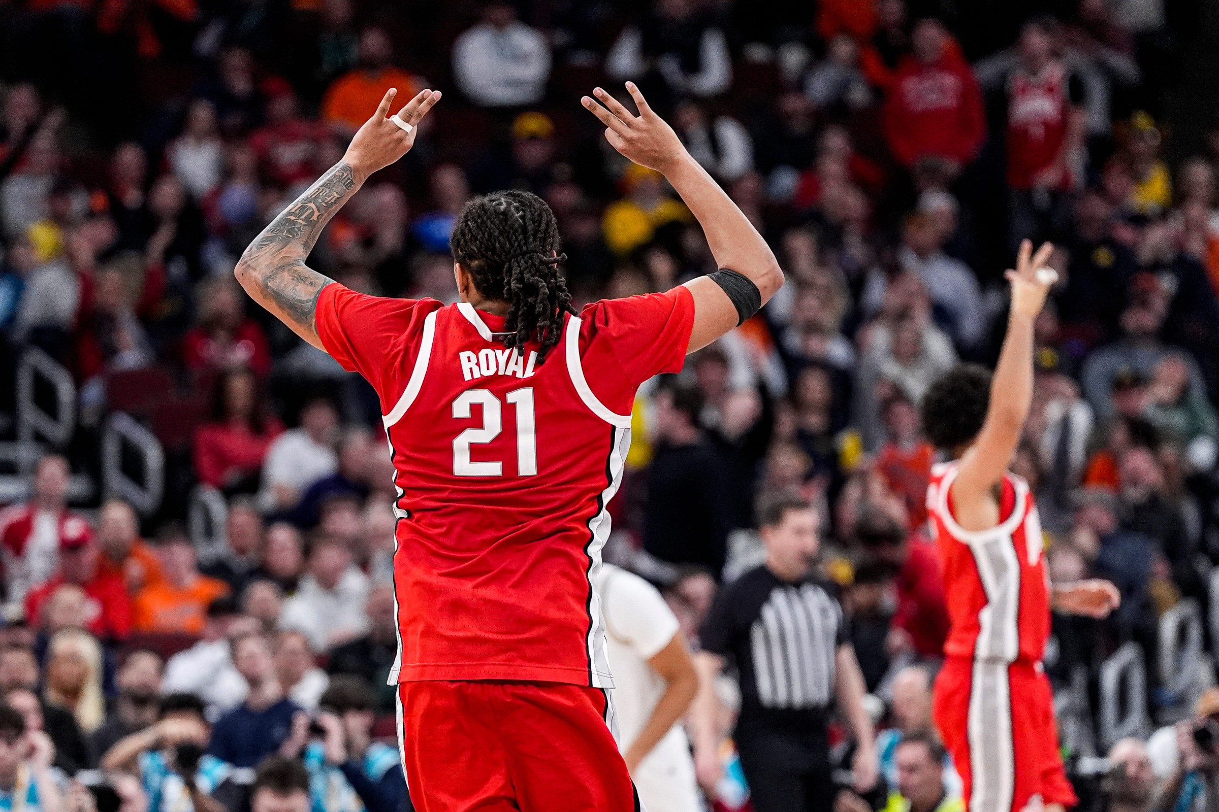 Ohio State forward Devin Royal (21) celebrates a 3-pointer against Michigan during the second half of Big Ten tournament quarterfinal at United Center in Chicago on Friday, March 13, 2026.
