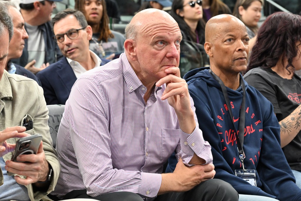 Steve Ballmer and Penny Hardaway watching a Los Angeles Clippers game.