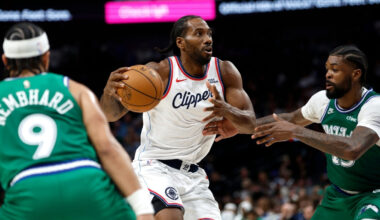 Kawhi Leonard #2 of the Los Angeles Clippers drives to the basket against Naji Marshall #13 of the Dallas Mavericks during overtime at American Airlines Center.