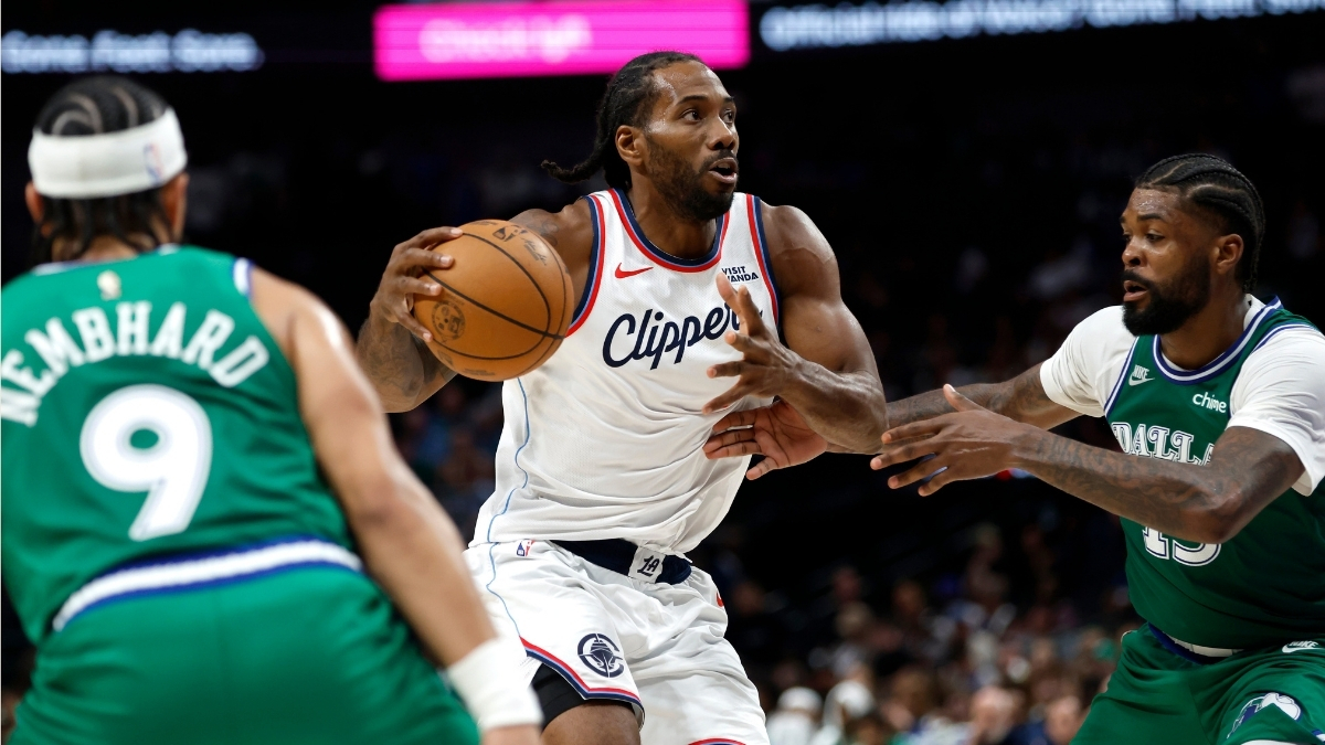 Kawhi Leonard #2 of the Los Angeles Clippers drives to the basket against Naji Marshall #13 of the Dallas Mavericks during overtime at American Airlines Center.