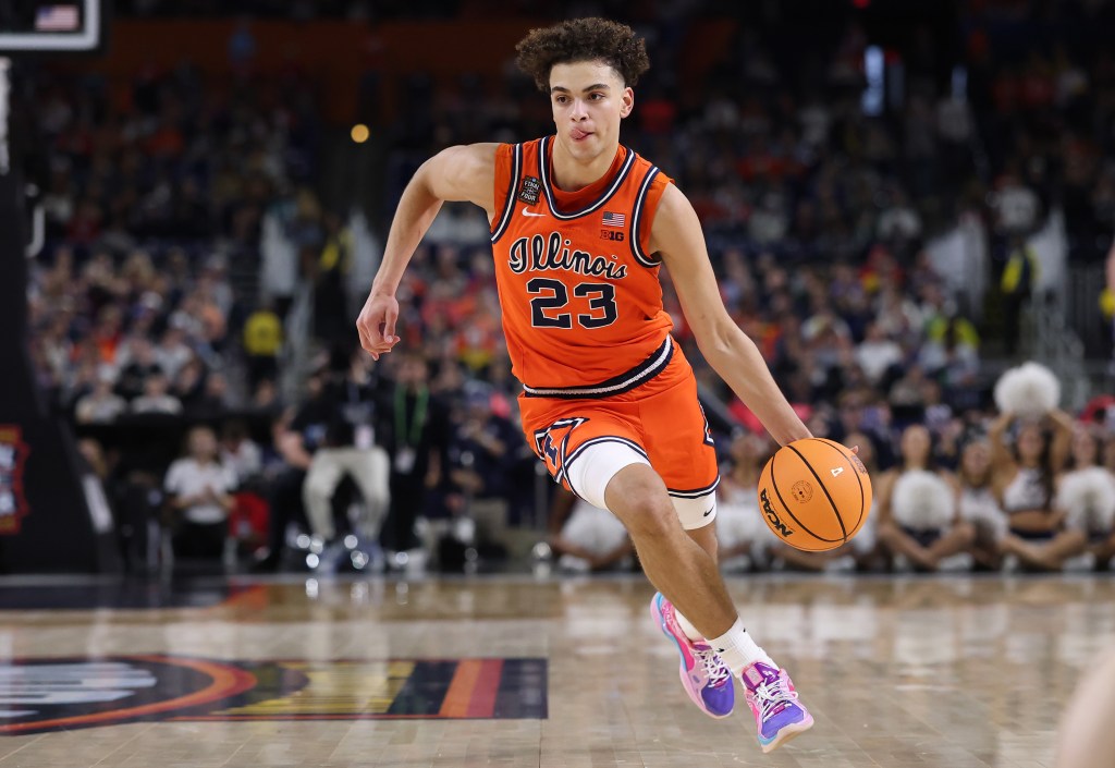 Keaton Wagler dribbling the basketball in an orange Illinois jersey.