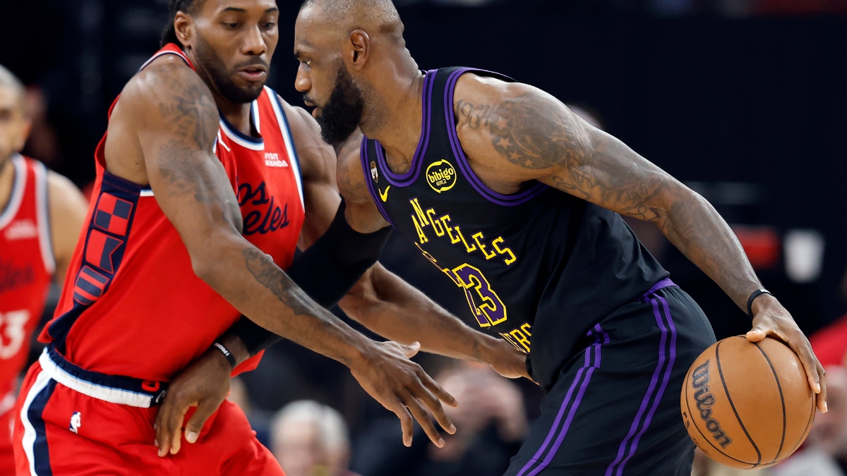 LeBron James #23 of the Los Angeles Lakers controls the ball against Kawhi Leonard #2 of the Los Angeles Clippers at Intuit Dome on January 22, 2026.