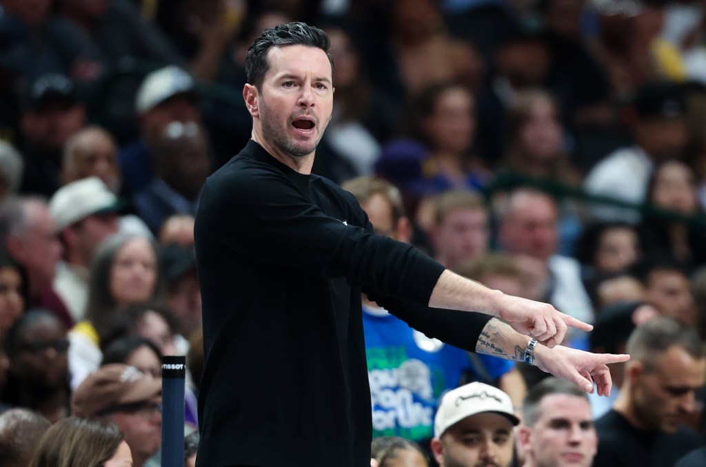Los Angeles Lakers head coach JJ Redick reacting during a game.
