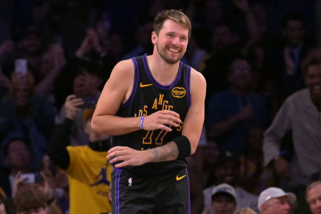 Los Angeles, California, USA; Los Angeles Lakers guard Luka Doncic (77) smiles after a dunk in the final minutes of the game against the Cleveland Cavaliers at Crypto.com Arena. Mandatory Credit: Jayne Kamin-Oncea-Imagn Images