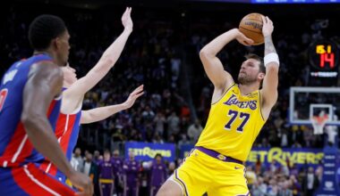 Los Angeles Lakers guard Luka Doncic (77) looks to make a shot-attempt in the fourth quarter of a loss to the Detroit Pistons in an NBA basketball game Monday, March 23, 2026, in Detroit. (AP Photo/Duane Burleson)