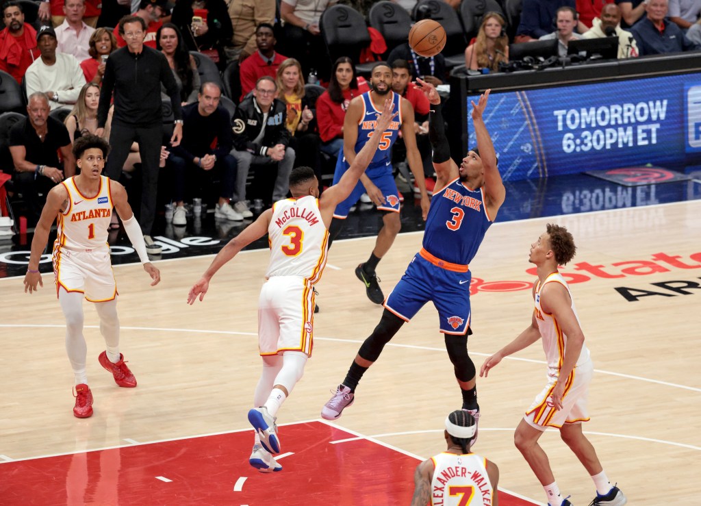 New York Knicks guard Josh Hart (3) shoots while Atlanta Hawks guard CJ McCollum (3) defends during Game 3 of the NBA Playoffs.