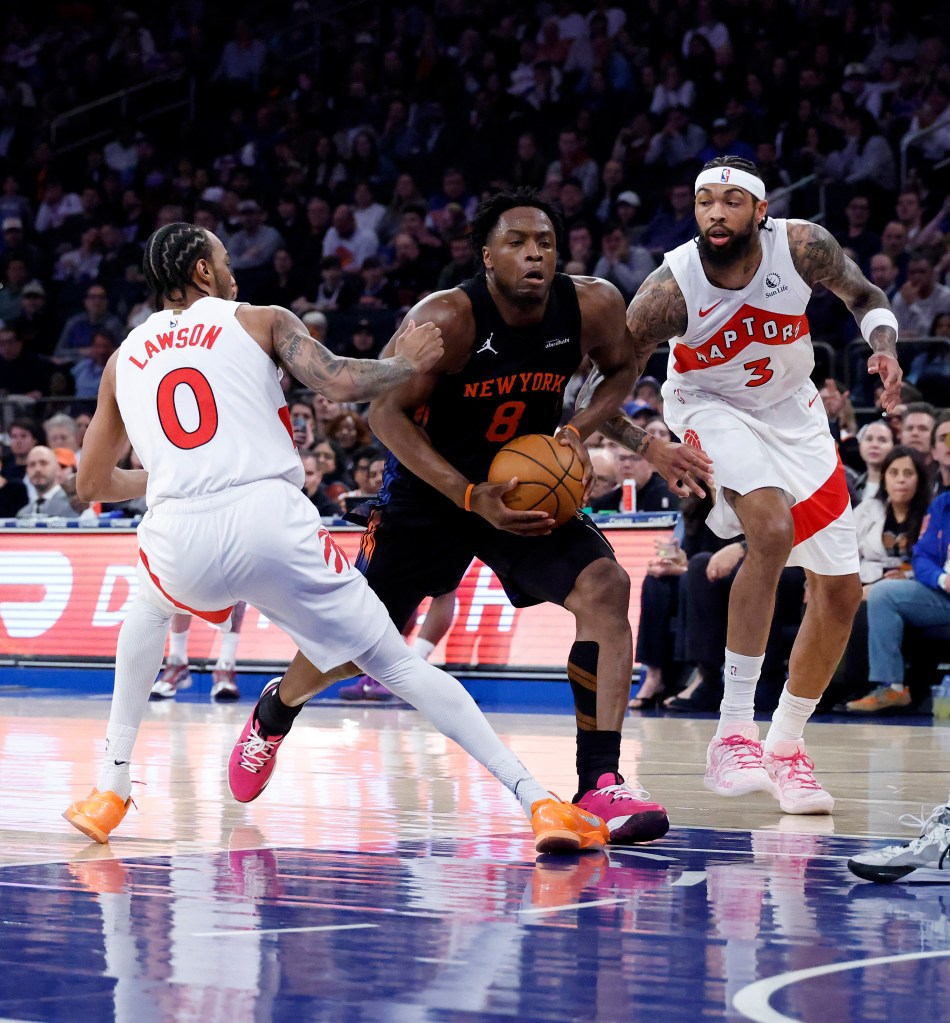 Og Anunoby drives to the basket between Toronto Raptors guard A.J. Lawson and Toronto Raptors forward Brandon Ingram during the first quarter in a game against the Toronto Raptors at Madison Square Garden in New York, New York, USA, Friday, April 10, 2026.