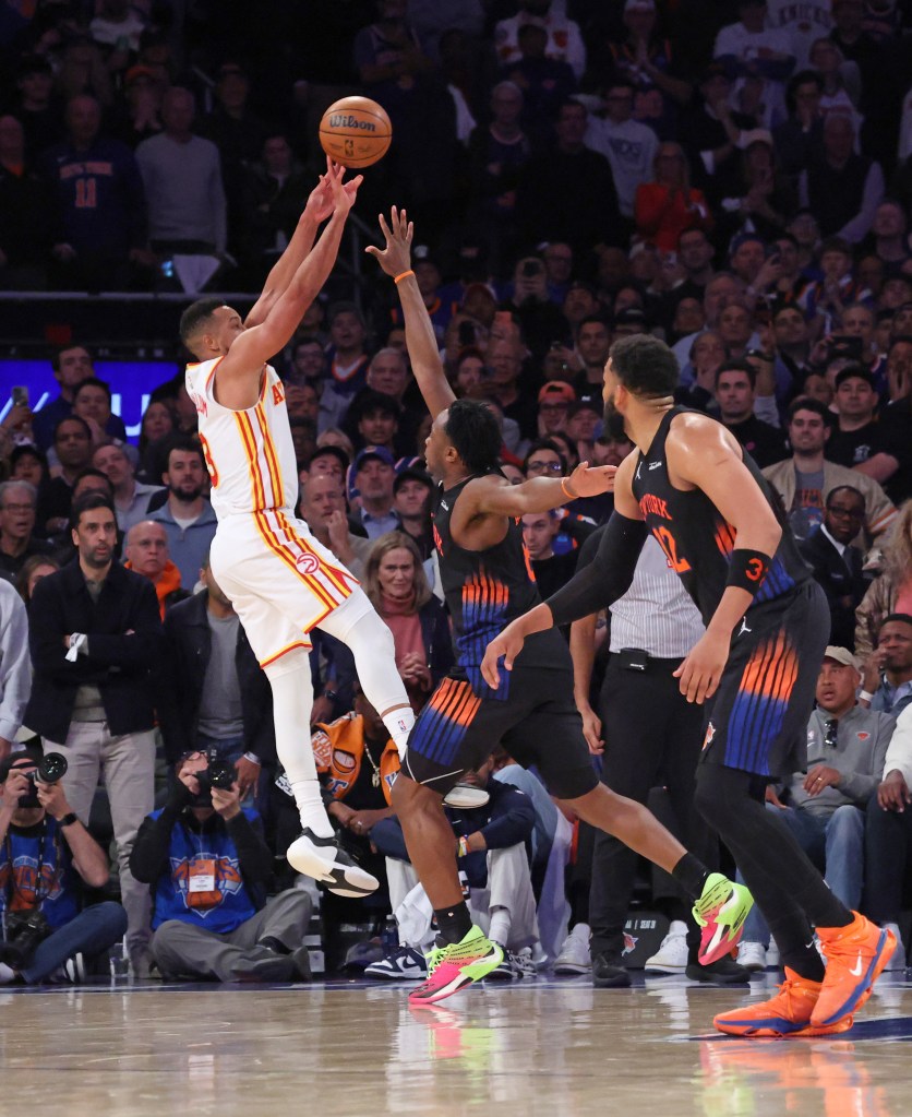 Atlanta Hawks guard CJ McCollum #3 puts up a shot over New York Knicks forward Og Anunoby #8 during the fourth quarter.