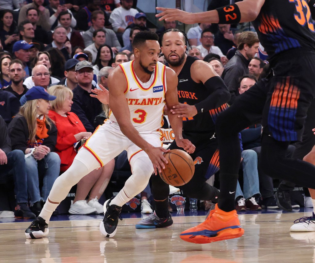 Atlanta Hawks guard CJ McCollum drives past New York Knicks guard Jalen Brunson.