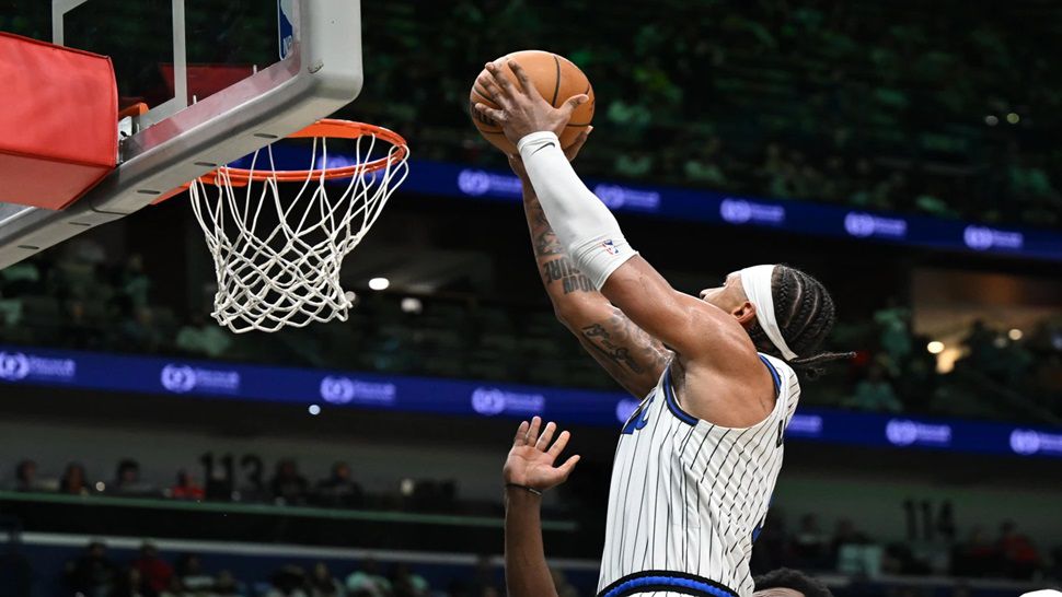 Orlando Magic forward Paolo Banchero (5) dunks in the second half against the New Orleans Pelicans in an NBA basketball game in New Orleans, Sunday, April 5, 2026. (AP Photo/Ella Hall)