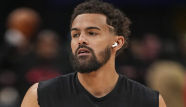 Trae Young looking on