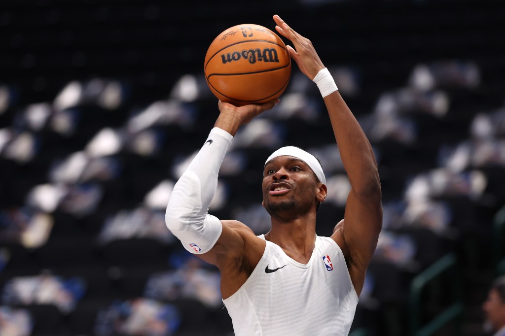 Oklahoma City Thunder player Shai Gilgeous-Alexander warming up prior to the game against the Dallas Mavericks.