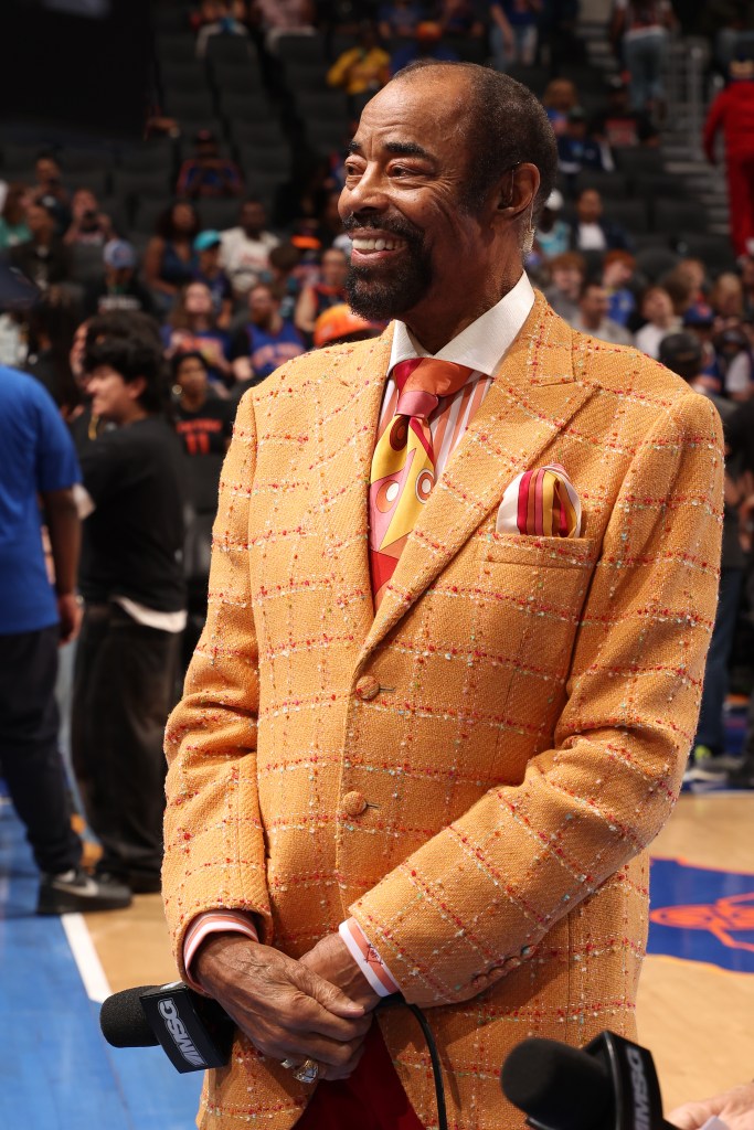 Walt Frazier smiles before the game between the New York Knicks and the Charlotte Hornets.