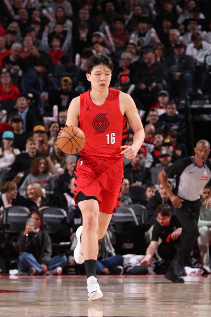 Yang Hansen #16 of the Portland Trail Blazers dribbles the ball during the game against the Washington Wizards on March 29, 2026 at the Moda Center Arena in Portland, Oregon.  