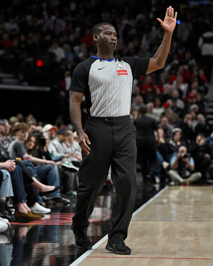 NBA referee James Williams officiating a game between the Utah Jazz and the Portland Trail Blazers.
