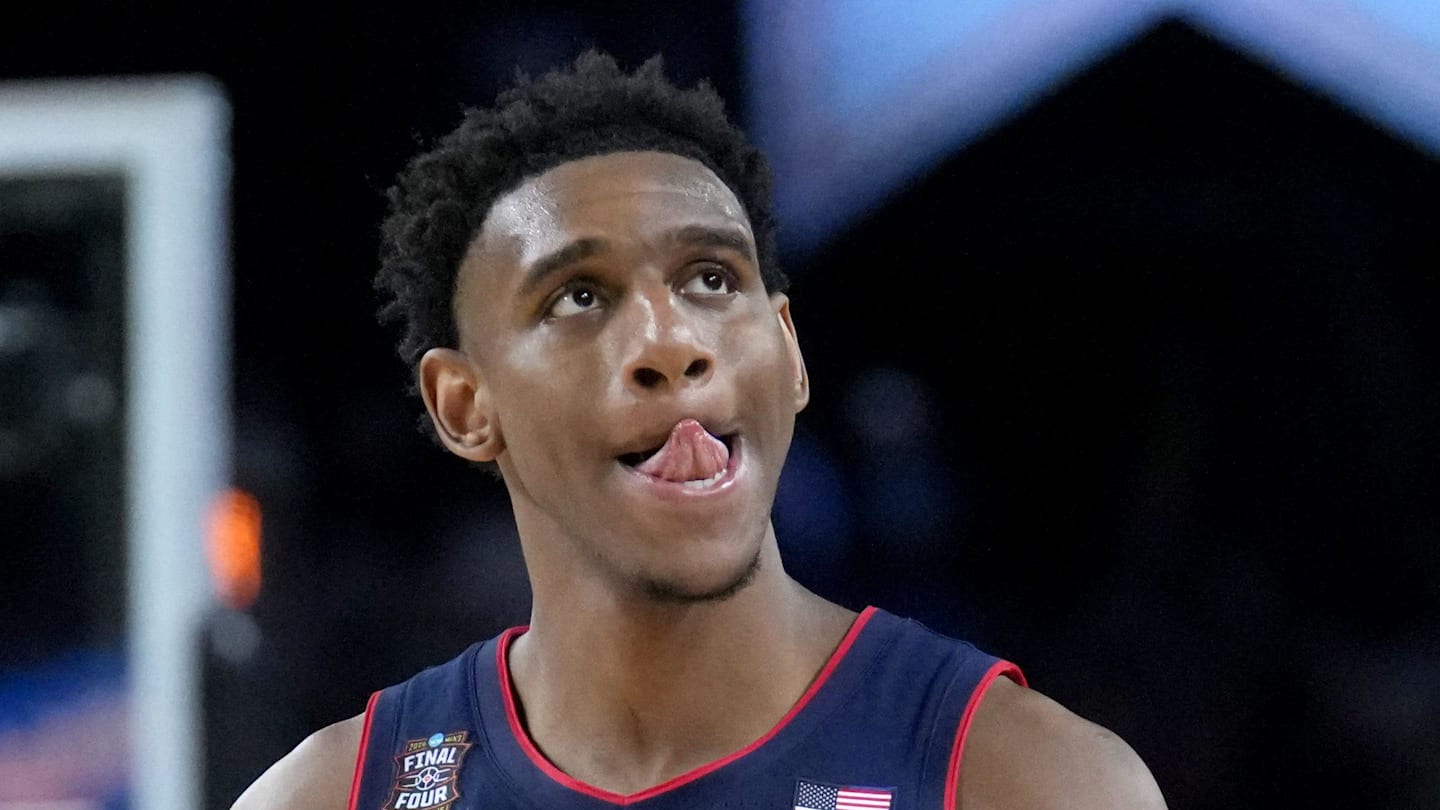 UConn Huskies forward Tarris Reed Jr. (5) walks off the court as time ticks off the clock Monday, April 6, 2026, during the NCAA men’s basketball national championship game against the Michigan Wolverines at Lucas Oil Stadium in Indianapolis.