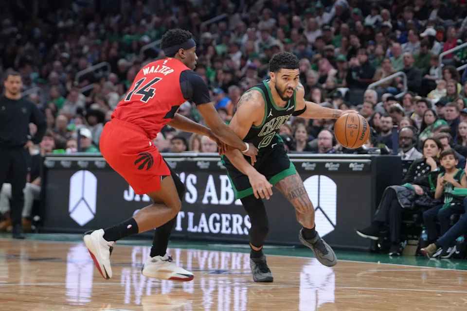 Apr 5, 2026; Boston, Massachusetts, USA; Boston Celtics forward Jayson Tatum (0) dribbles the ball against Toronto Raptors guard Ja'Kobe Walter (14) during the first half at TD Garden. Mandatory Credit: Gregory Fisher-Imagn Images