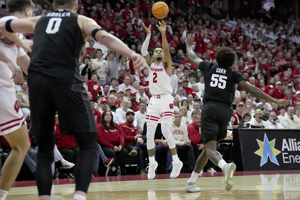 Wisconsin guard Nick Boyd (2) hits a three-point basket during the second half of their game Friday, February 13, 2026 at the Kohl Center in Madison, Wisconsin. Wisconsin beat 10th ranked Michigan State 92-71.